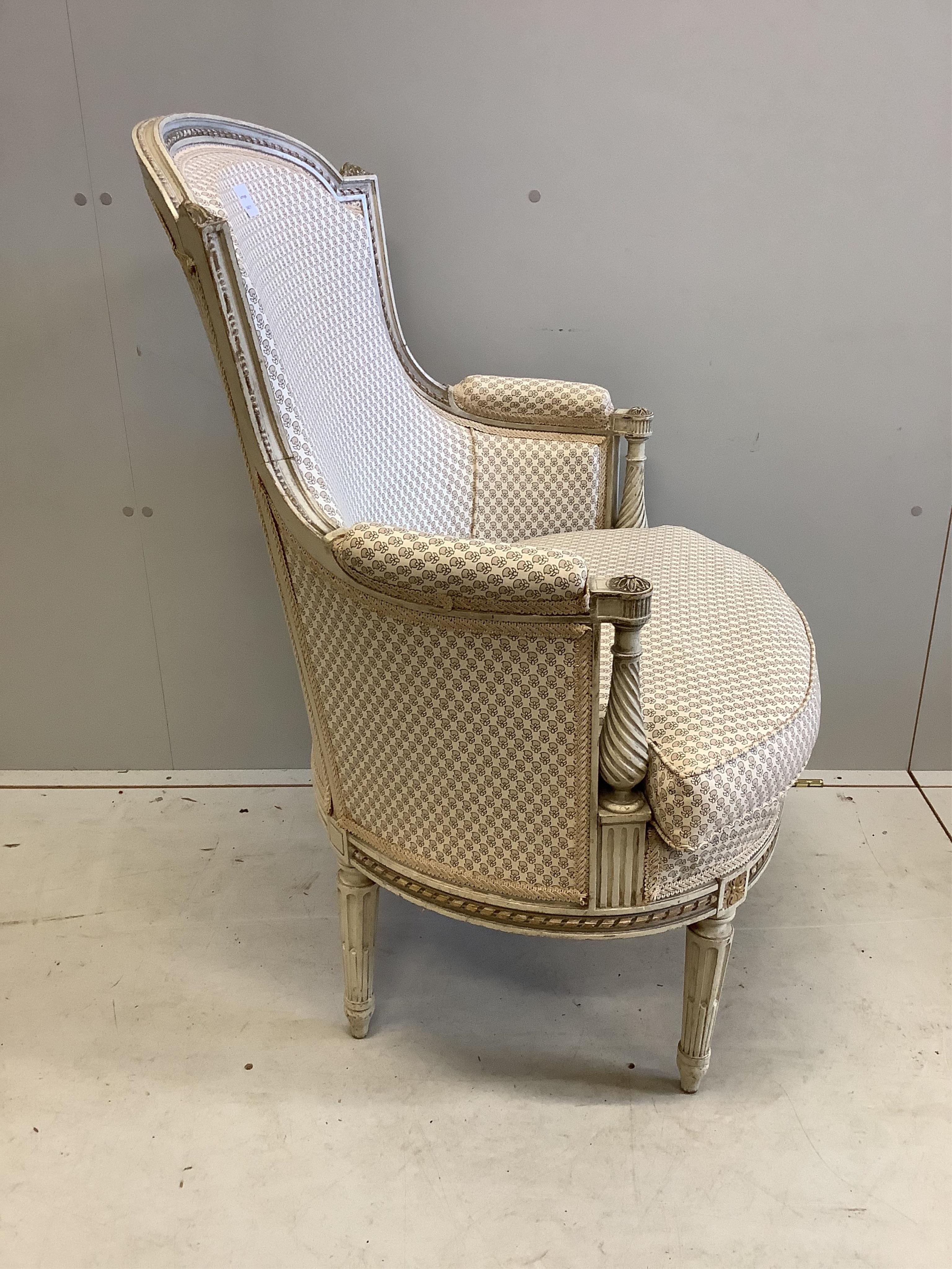 A Louis XVI style cream painted upholstered armchair, width 68cm, depth 56cm, height 99cm. Condition - good